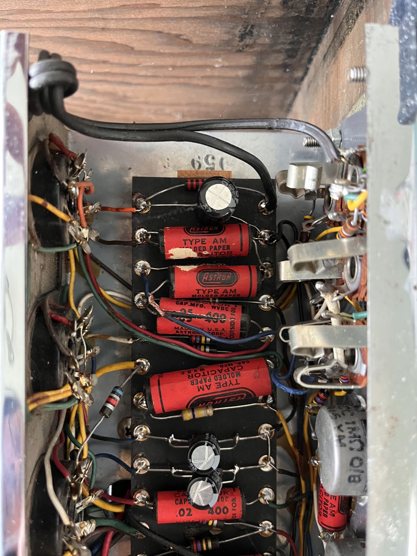 Original turret board inside the Ampeg M-15, showing factory and prior-repair work side by side