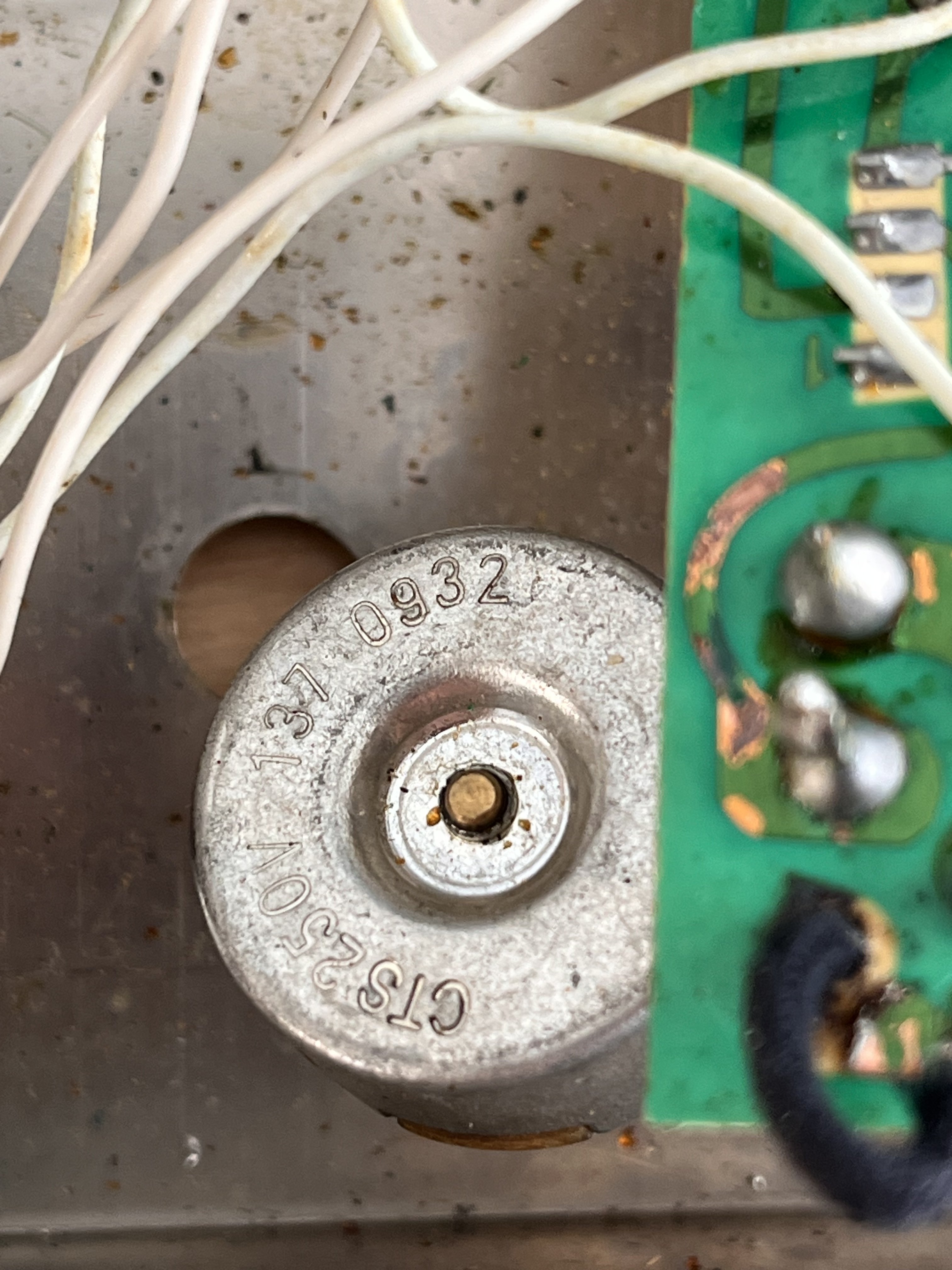 The Color pot's stamped markings, confirming a non-original part
