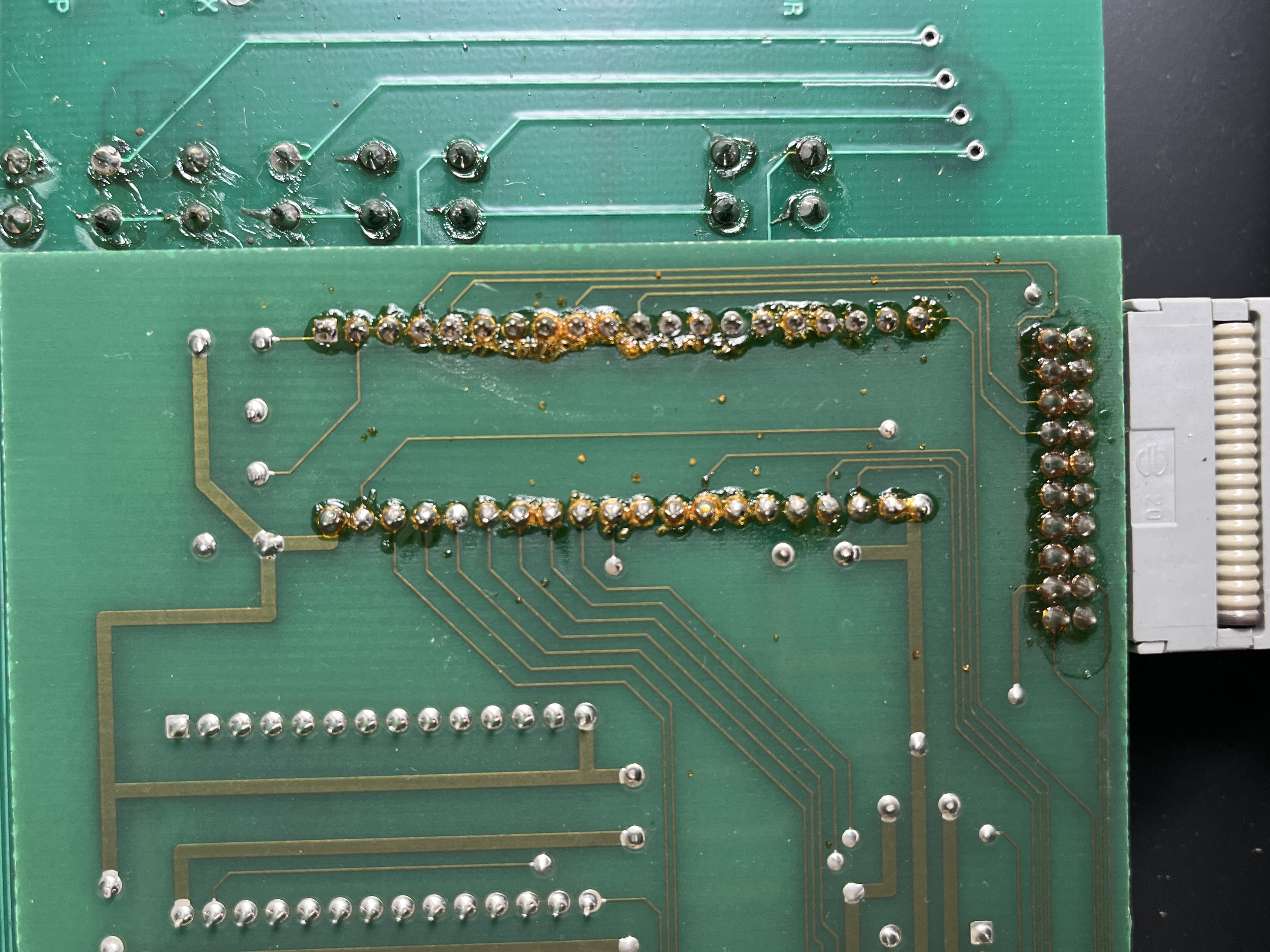 Corroded solder joints on the display board caused by heat from the transistor below