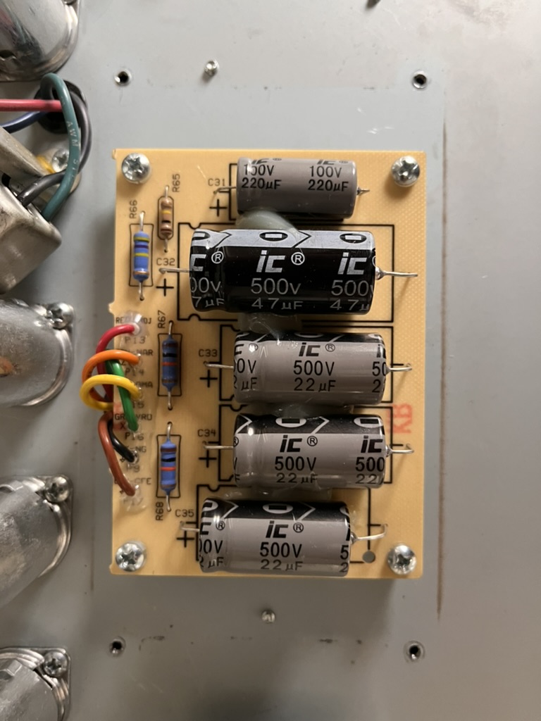 The reissue's original filter cap board with IC branded stock caps