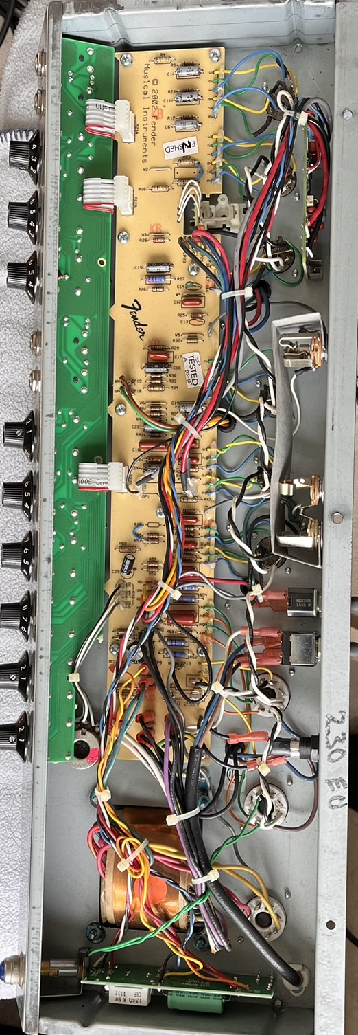 The reissue's main PCB with a small green daughterboard added for RoHS compliance