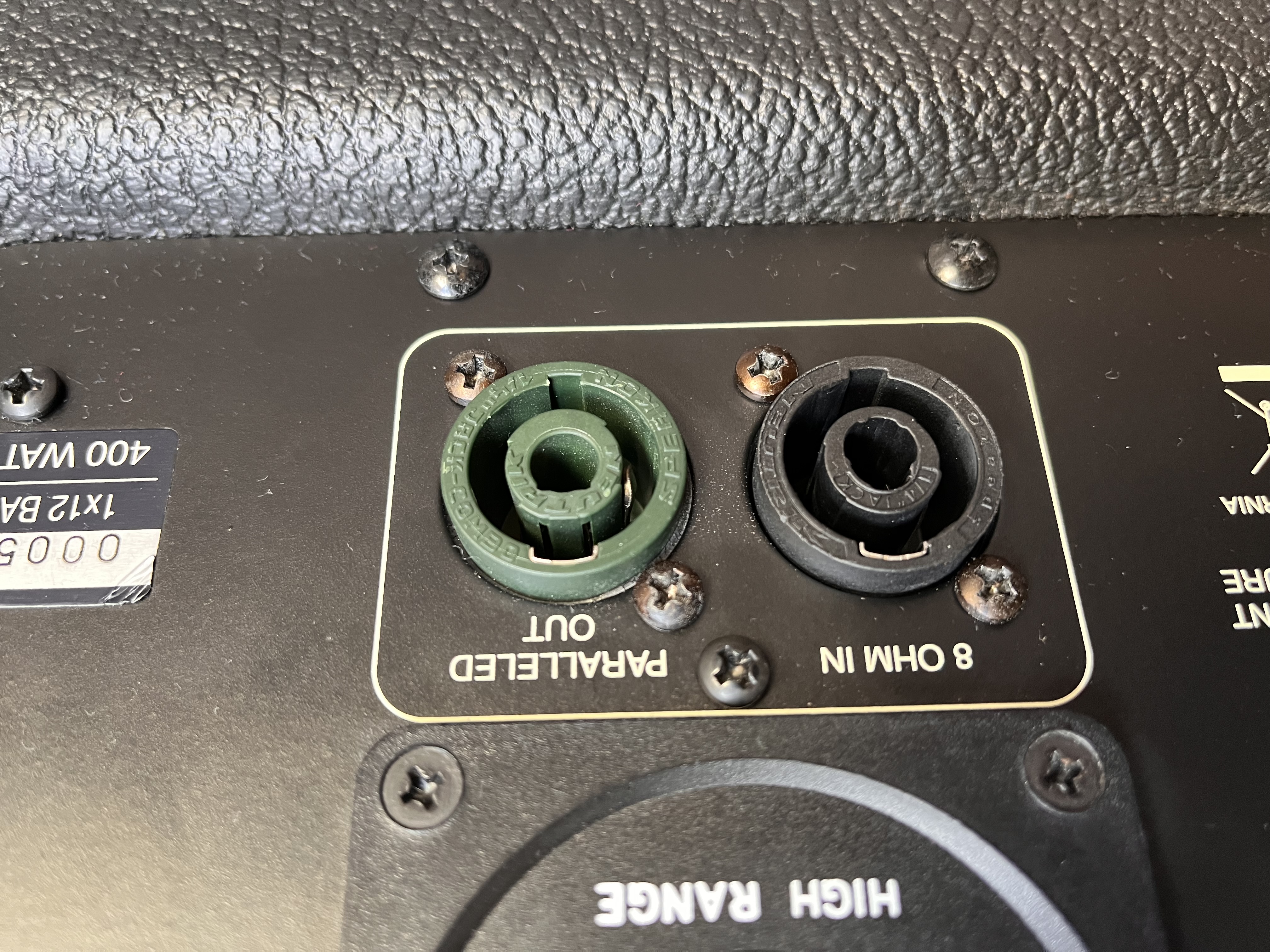 Rear panel of the Mesa Subway showing the new black Neutrik NL4 input alongside the original green paralleled output