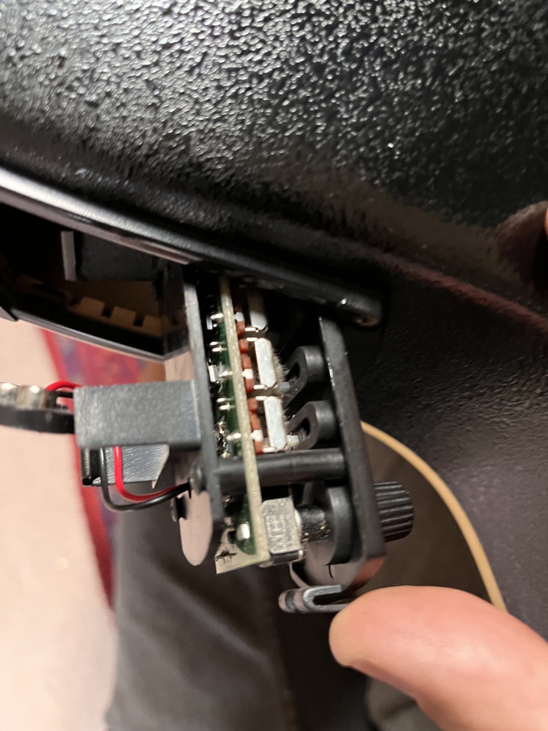 Corrosion visible in the preamp cavity around the wiring