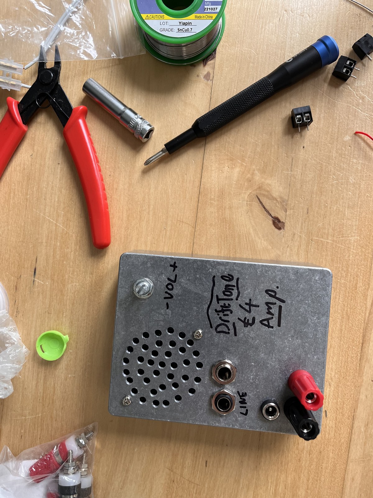 The DriftTone £4 Amp — finished enclosure on the bench with tools