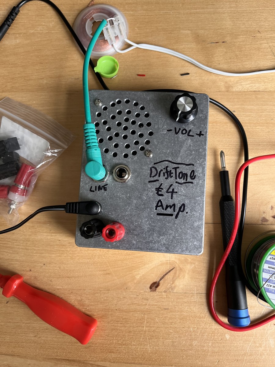 The £4 Amp in use on the bench with line input and banana plug power connected