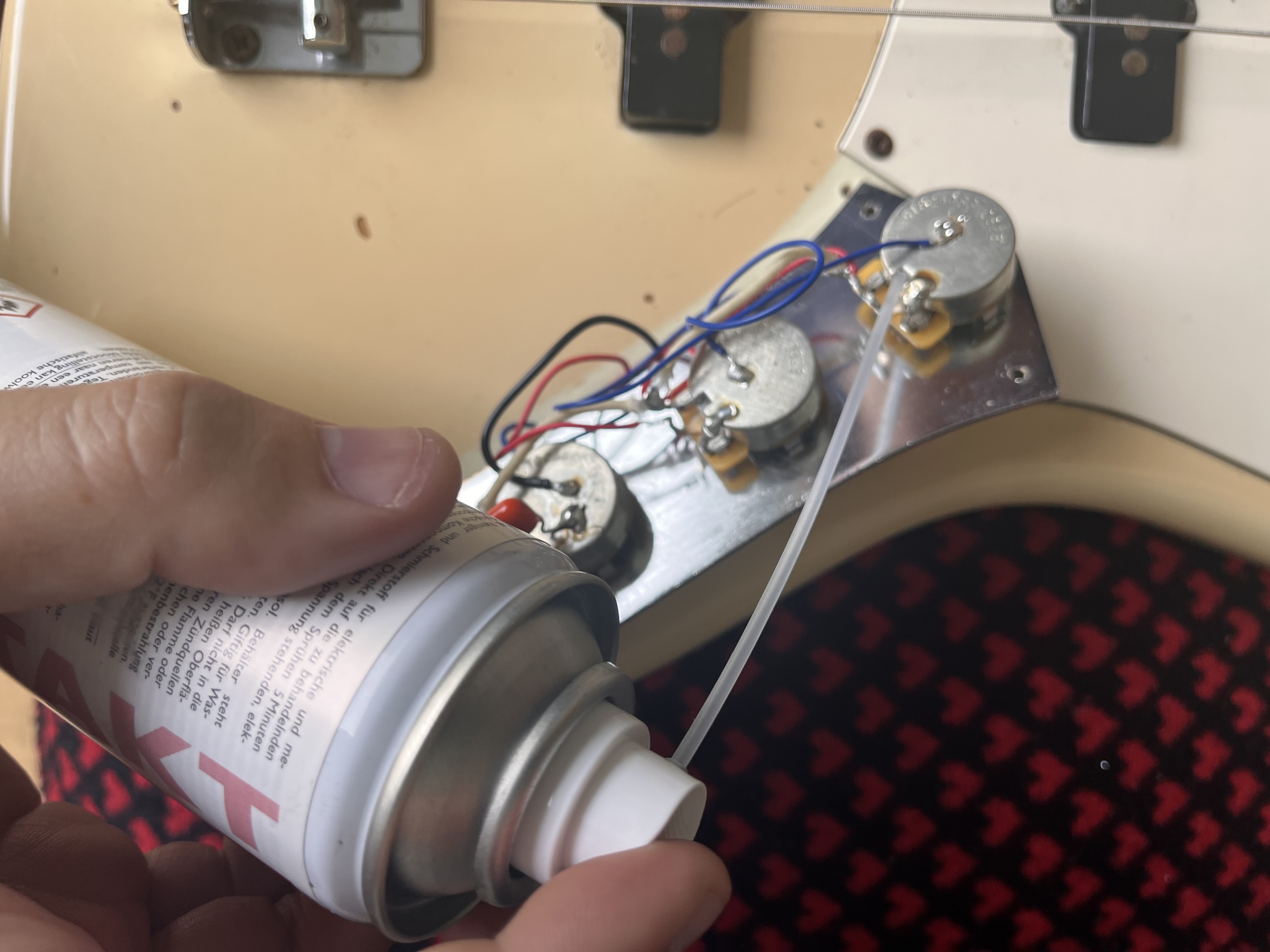 Contact cleaner being applied to Stratocaster pots