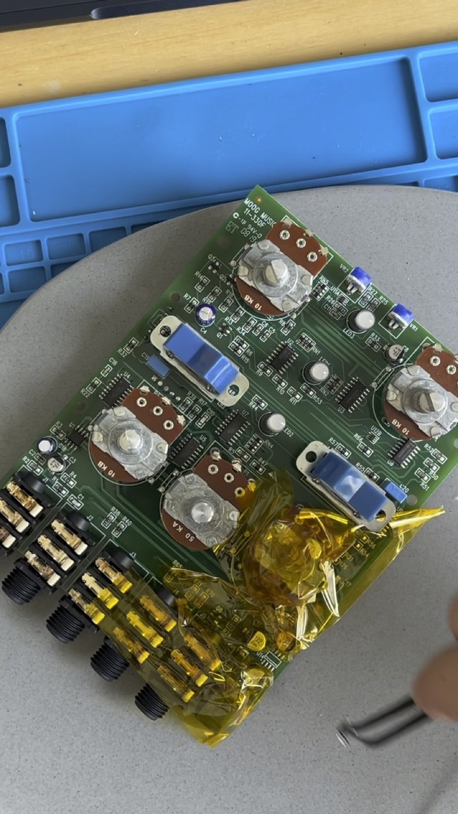 Moog Moogerfooger PCB out on the bench with replacement components ready